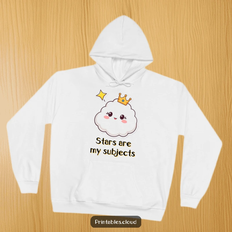 Funny hoodie depicting a crowned cloud character looking surprised and amazed at a bright shooting star, perfect for cozy nights.