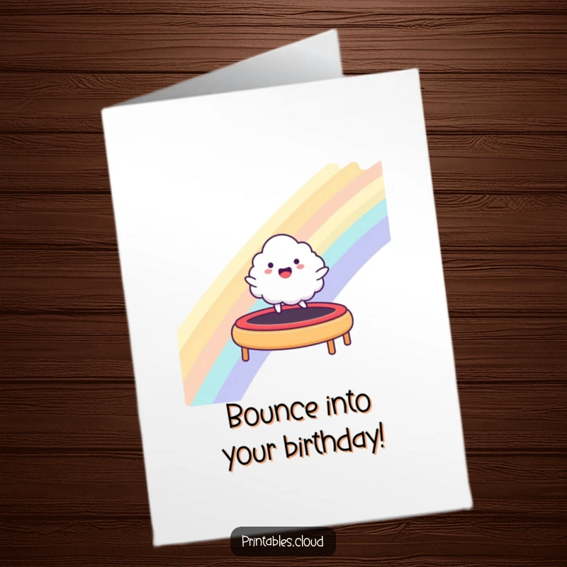 Funny Free Printable Birthday Card: A happy cloud character joyfully bounces on a rainbow, sending fun birthday wishes.