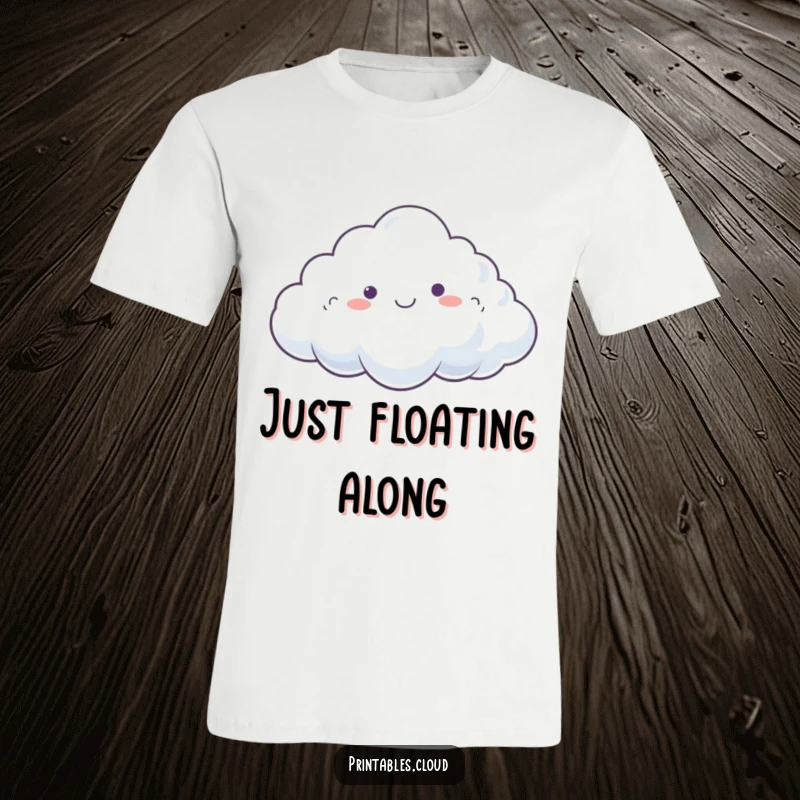Funny T-Shirt showing a dreamy cloud character happily drifting on a gentle breeze, embodying tranquility.